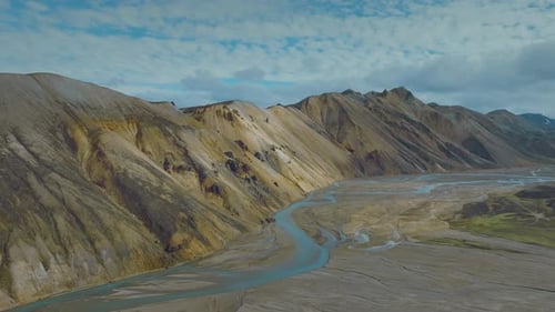 Surreal mountain scape in the picturesque Iceland. Colourful mountains and river landscape.