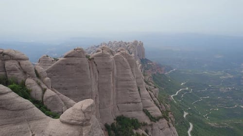 Mountain peaks in Montserrat Natural park, aerial establishing view
