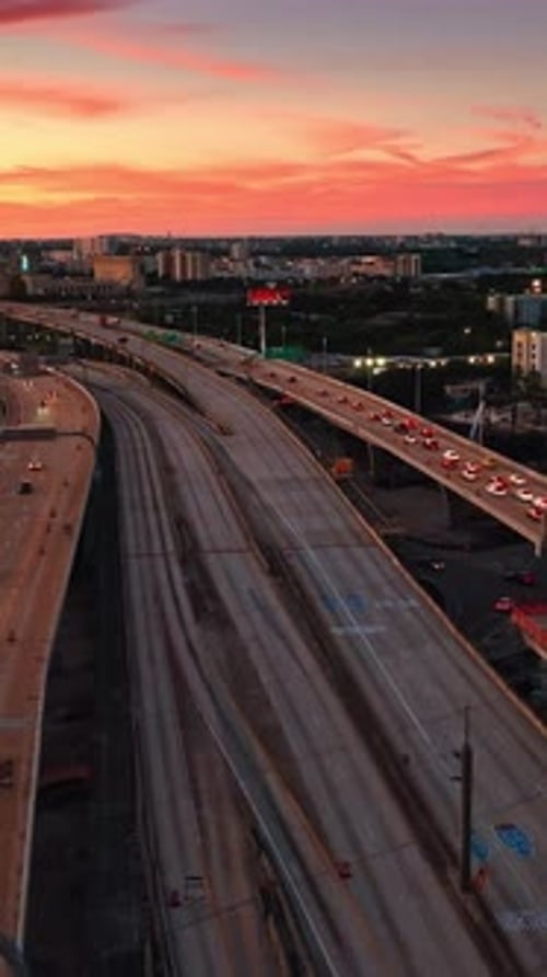 Few multi-lane roads on the freeways with cars moving by.