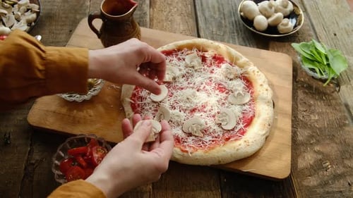 Arranging Sliced Mushrooms on Pizza at Home