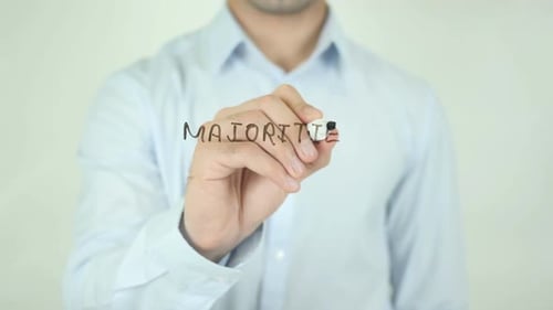 Man Writes Majorities on Clear Surface