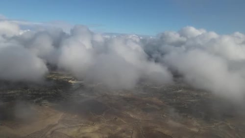 Aerial View of Clouds and Landscape