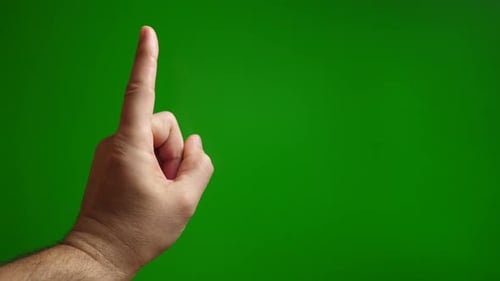 25a. Point finger up (attention) on green background.