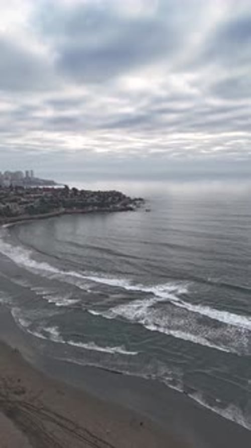 Timelapse Overcast Morning View of Tranquil Bay and Beachfront