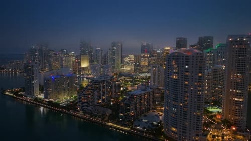 A Captivating Aerial View of Downtown Miami at Night with Its Stunning Skyline and Lights