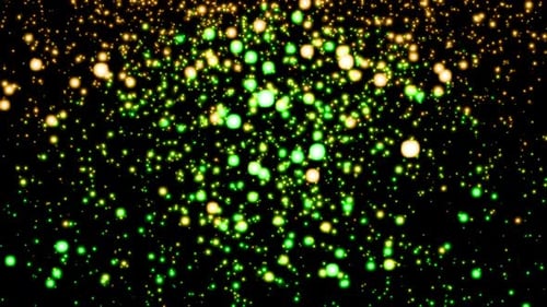 Continuous stream of green and golden particles endlessly fall and shimmer against a black
