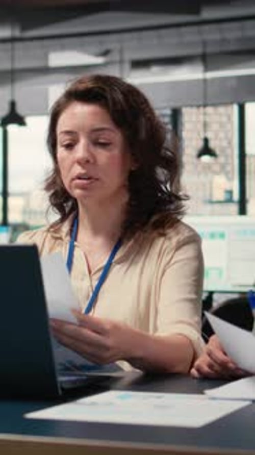Vertical Video Empowered Businesswomen Evaluating Graphs and Strategy Reports