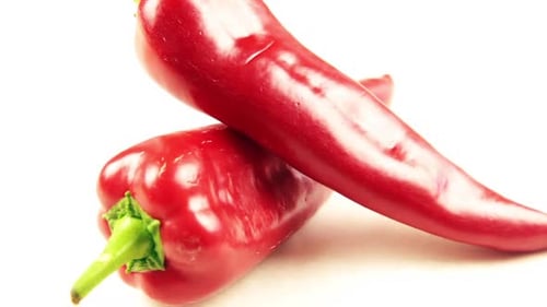 Two Red Peppers on a White Background