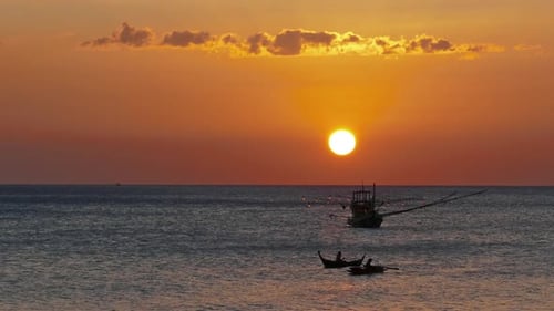 Fishing Boat in Sea at Sunset