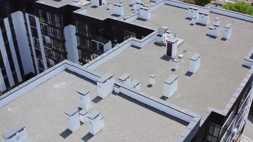 Roofs of a modern multi-storey complex. High apartment buildings in new district in the city.