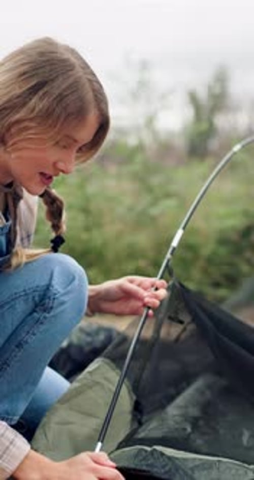 Woman, camping and pitch tent for travel, vacation and holiday in nature