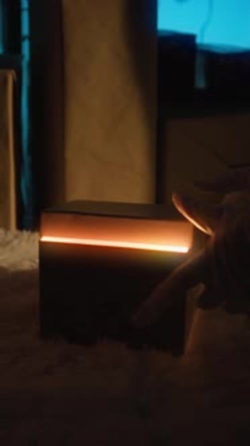 Silhouette Of Santa Claus Delivers A Mysterious Christmas Box Under The Tree