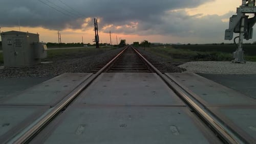 Drone Shot Tracking Low Just Above Railroad Tracks After Sunset In Texas, U.S.A.