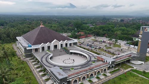 Aerial view of huge mosque with a towering minaret.