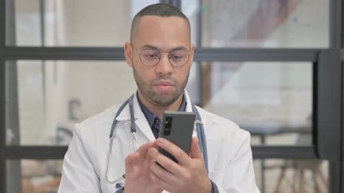 Doctor Using Smartphone in a Hospital Setting