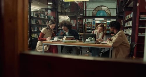 Education, studying and students in library, talk and deadline for assignment, tech and books