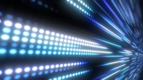 Abstract bright blue background pattern of flying circles of dots and glowing futuristic digital