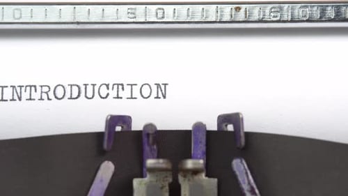 Introduction word closeup being typing and centered on a sheet of paper on old vintage typewriter