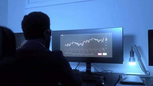 Business African trader investor use AI virtual reality headset for stock exchange market in office