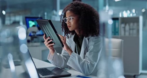 Woman Scientist Working With Tablet in Lab