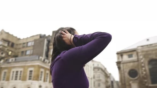 Young middle eastern gothic woman looking on a church nervous and scared with no one around creative