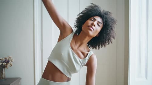 Yoga Girl Making Slopes Close Up. Athletic Woman Performing Asana at Home