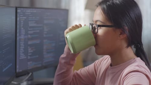 Close Up Of Teen Girl Programmer Drinking Water While Creating Software Engineer Developing App