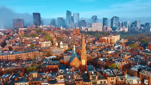 Old-fashioned cityscape of Boston of mainly red-brick houses.