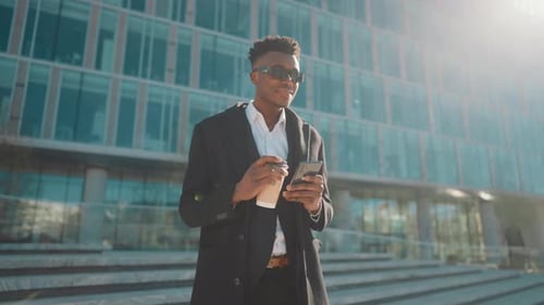 Young Adult Using Phone, Drinking Coffee, City Background
