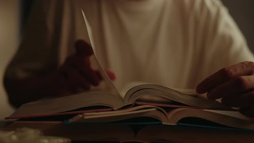 Page Turning in Stack of Books