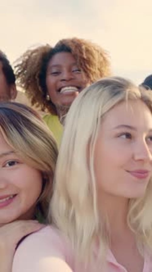 Happy Blonde Woman Taking Selfie with Multiethnic Friends Outdoors
