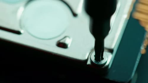 Screwdriver Repairing Computer Hard Drive Close Up