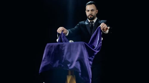 Magician Performing with Silk Cloth and Table
