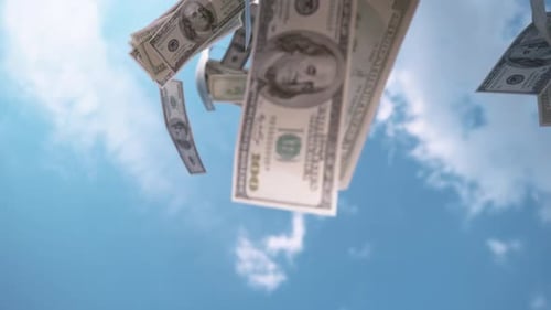 SLOW MOTION, CLOSE UP: € Money falling from the sky. Fifty and hundred euro bills falling from sky