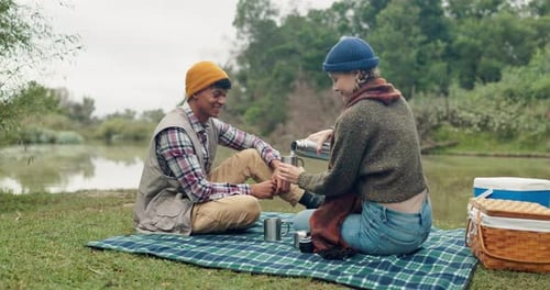 Coffee, toast and couple in a forest for picnic, celebration or romantic holiday in nature together