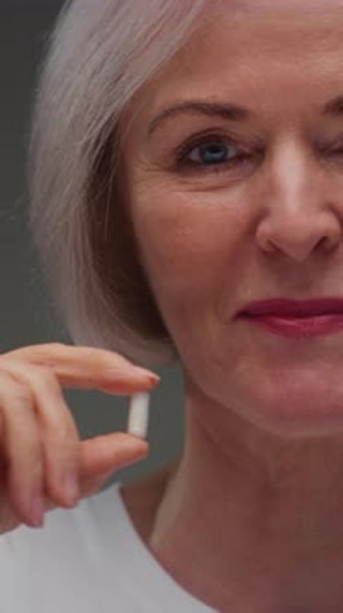 Portrait Senior Woman Hand Holding Painkiller Pill Capsule Old Female Taking Medicine Pharmacy