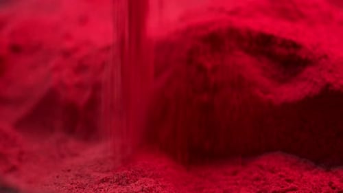 Abstract Red Sand Falling Close Up