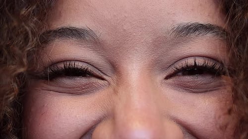 Close-up eyes of young beautiful african american model looking at the camera. Girl with big eyes. 4