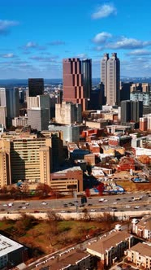 Beautiful view of Atlanta downtown with busy wide road going around.