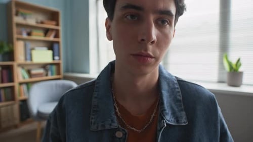 Young Adult Sits Indoors, Close Up Portrait