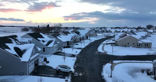 Snow Covered Homes at Winter Sunrise