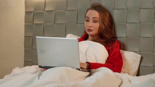 Tired Young Woman Yawning Lying on Bed with Laptop Lazy Student Doing Homework Sleepy Girl Working