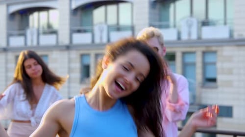 Close Up of Pretty Female Having Fun Dancing and Jumping at a Party Waving Her Hair and Laughing