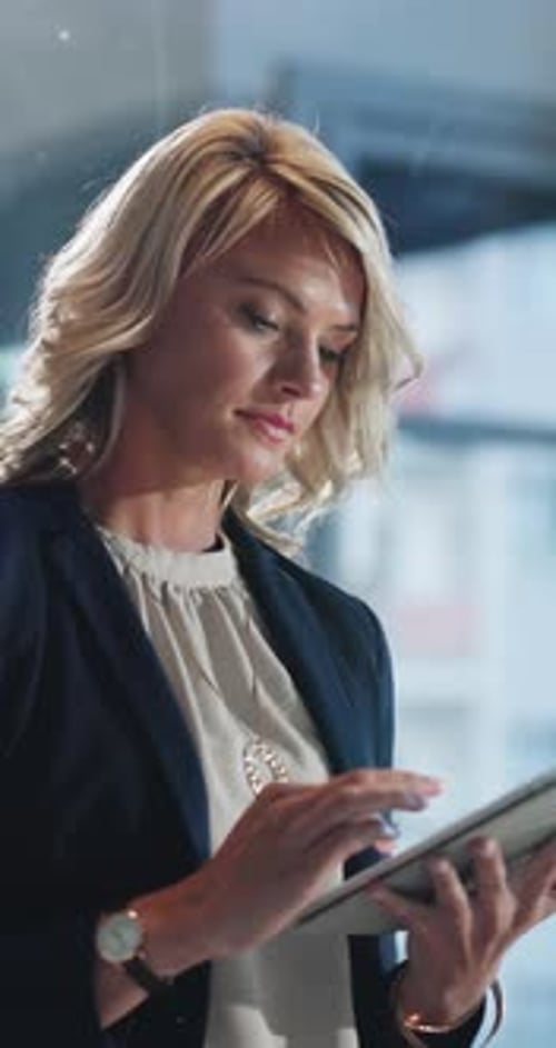 Tablet, scrolling and businesswoman in office with research for finance review with company budget