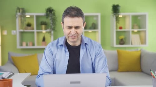 Home office worker man is thoughtful.