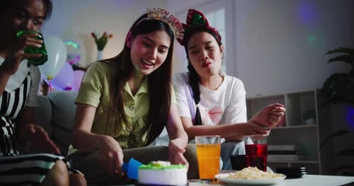 Friends Celebrate Birthday with Cake and Drinks