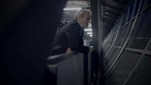 A Businessman Appears Deeply Engaged in Contemplation Within a Modern Office Environment