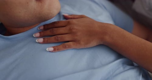 Loving Couple Resting Comfortably in Bed