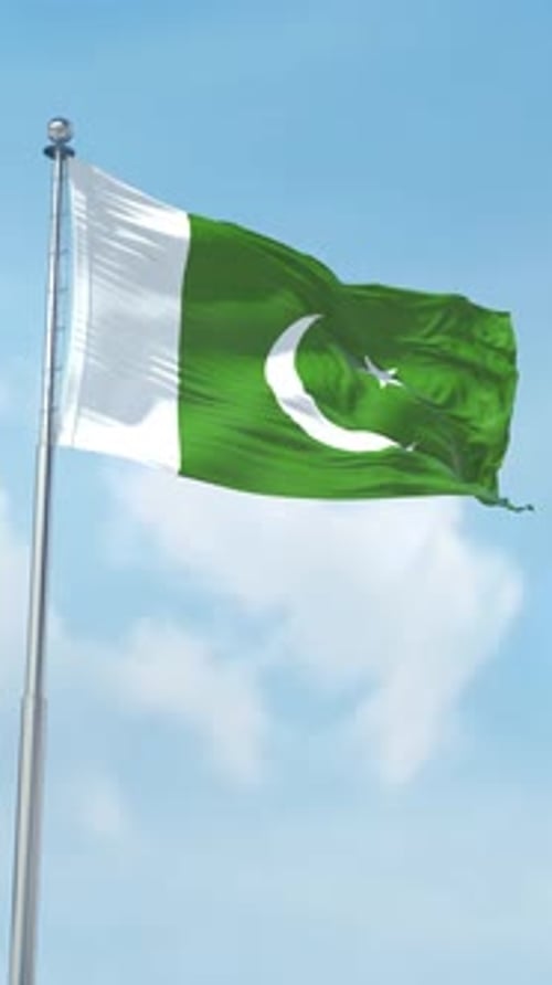 Pakistan Flag Waving on Pole Against Blue Sky