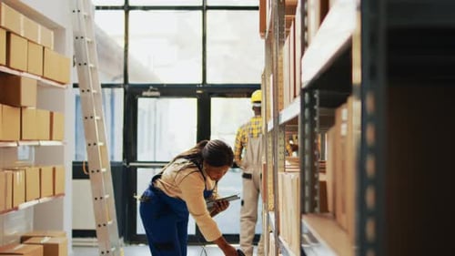 Female Employee Scanning Barcodes on Packages